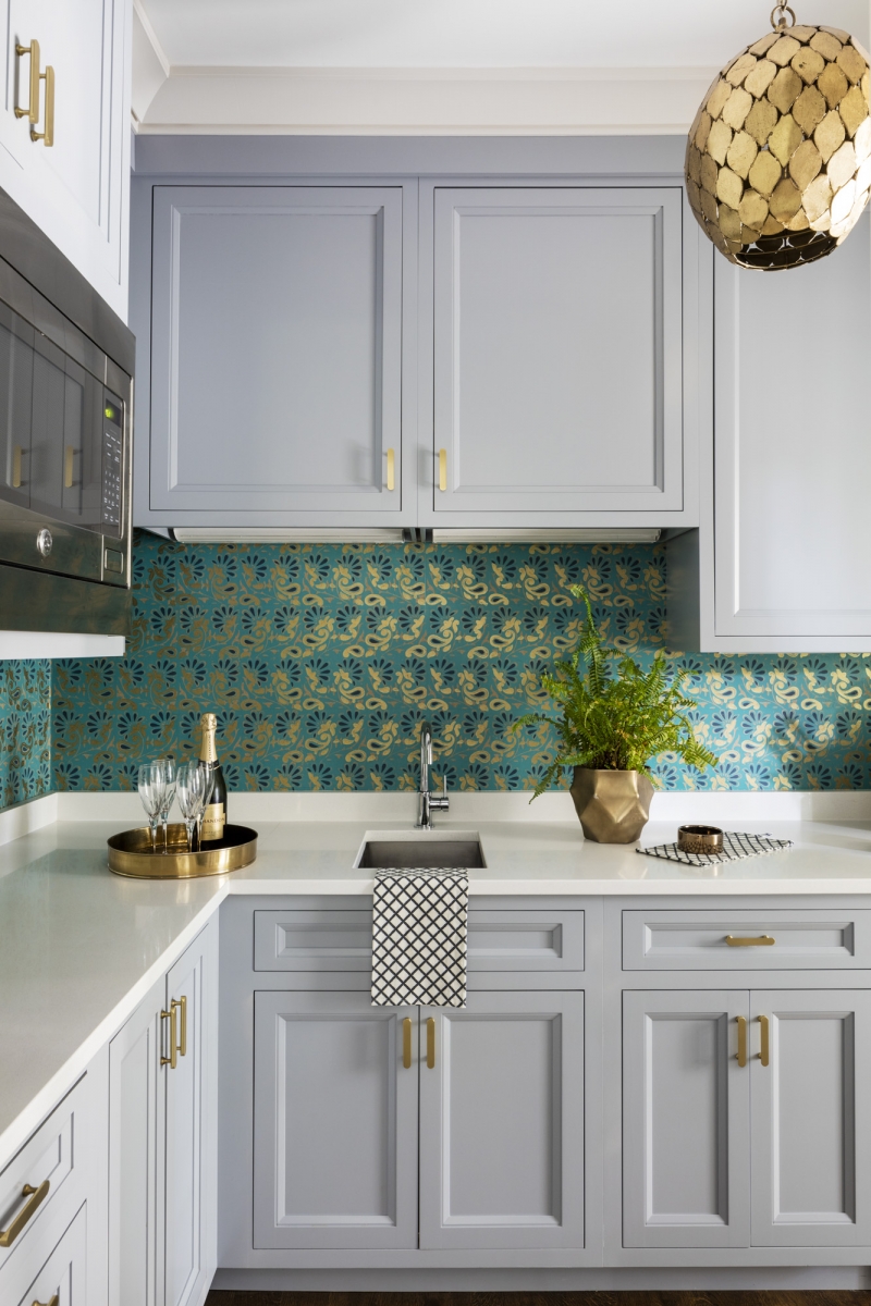 Grey cabinets with patterned wallpaper