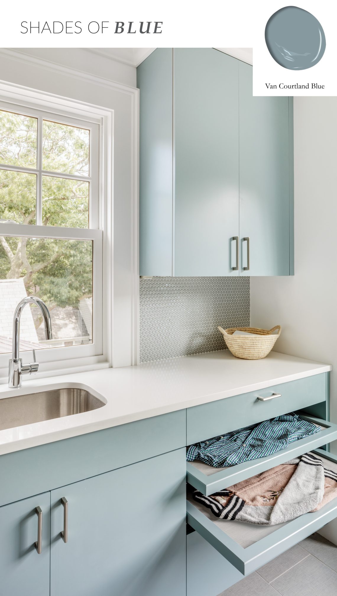 Laundry space cabinets painted with the Van Courtland Blue paint color