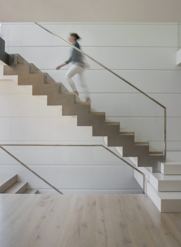 Woman walking up a staircase