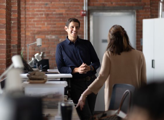 Ricardo speaking with colleauge